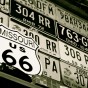 license plates and route 66 sign black and white